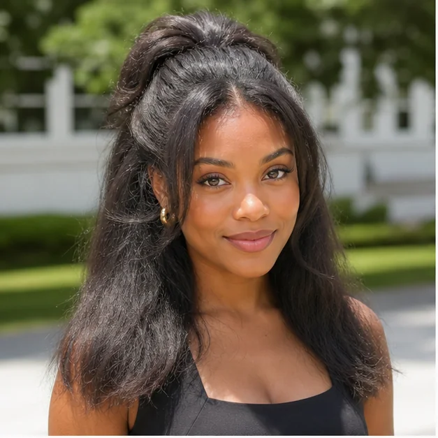 Black woman wearing a half-up fluffy press hairstyle