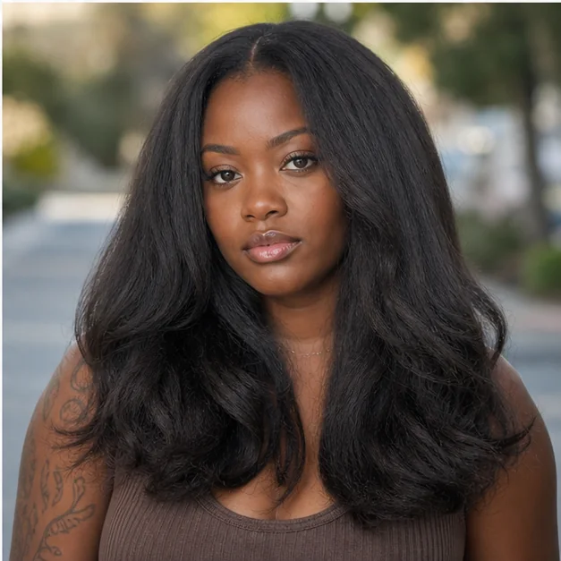 Black woman with a long fluffy press and softly bent ends
