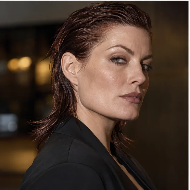 Woman wearing a sleek wet-look modern mullet