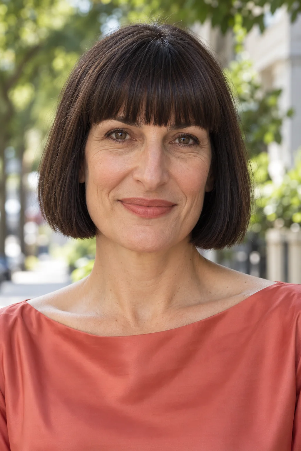 Black brown jaw-length blunt bob with a full straight brow-level fringe